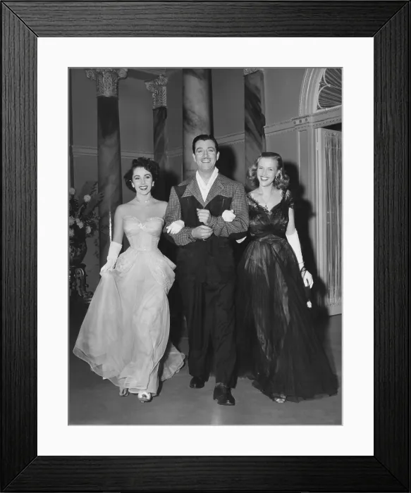 Framed Print : CONSPIRATOR, from left: Elizabeth Taylor, Robert Taylor, Honor Blackman on set, 1949