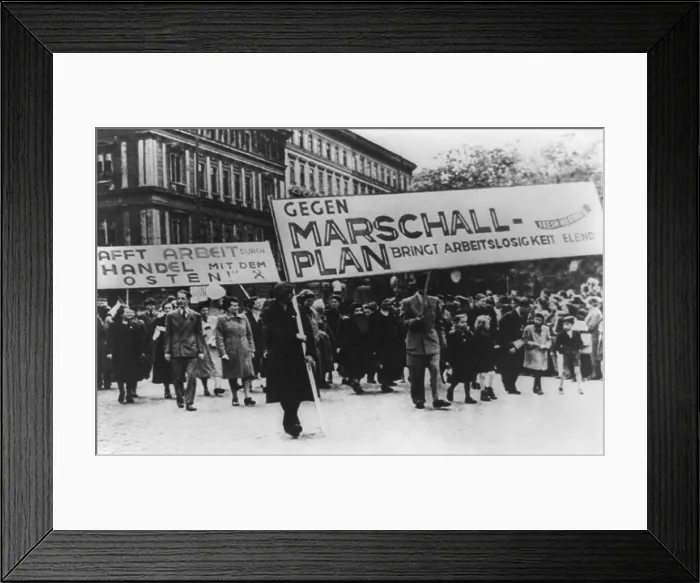 Framed Print : East Germans demonstrate against Marshall Plan. The sign translates to Against Marshall Plan Brings Unemployment Misery'. Ca. 1952. (BSLOC_2014_13_30)