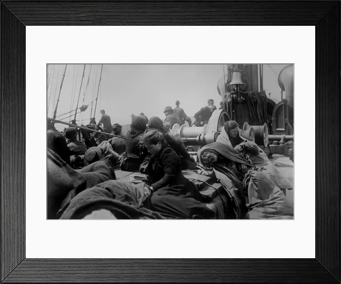 Framed Print : A young women reading on the steerage deck of an ocean liner approaching the Port of New York