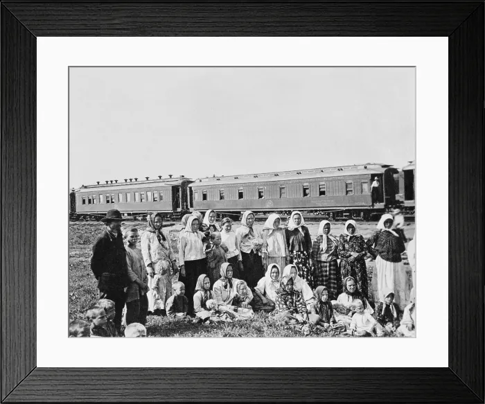 Framed Print : Russian men, women, and children in traditional dress posing in near a passenger train in a Siberian field Framed Print : Russian men, women, and children in traditional dress posing in near a passenger train in a Siberian field