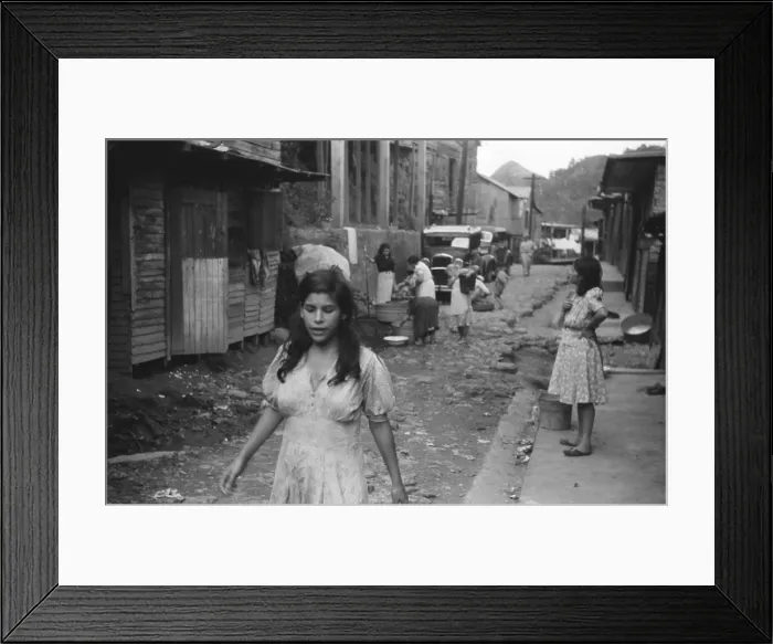 Framed Print : A street in the slum area of the hill town of Lares, in western Puerto Rico. January 1942 photograph by Jack Delano