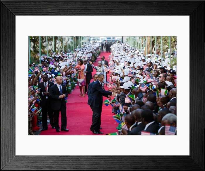 Framed Print : President Barack Obama and First Lady Michelle Obama shake hands with the Tanzanian crowd