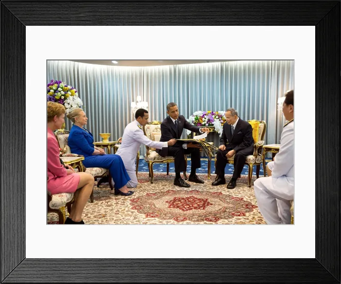 Framed Print : President Barack Obama presents a gift to King Bhumibol Adulyadej of Thailand. The gift was a photo album containing photos of the King with U.S