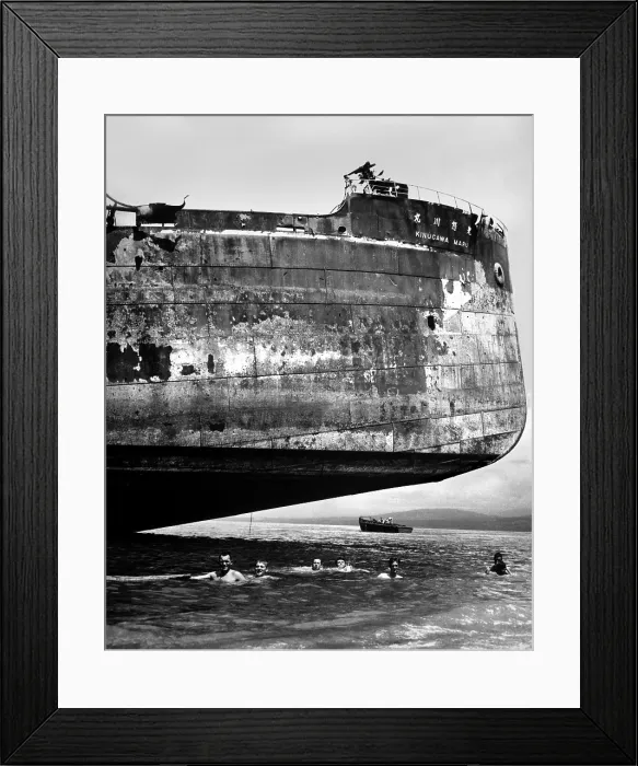 Framed Print : U.S. Coast Guardsmen swim near the wrecked Japanese transport, Kinuga Maru at Guadalcanal Framed Print : U.S. Coast Guardsmen swim near the wrecked Japanese transport, Kinuga Maru at Guadalcanal