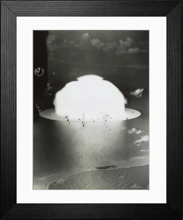 Framed Print : The BAKER test of Operation Crossroads was exploded underwater on July 25, 1946. Image shows condensation cloud and air shock wave moving over the water and target ships