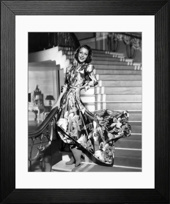 Framed Print : WIFE, DOCTOR AND NURSE, Loretta Young, in floral taffeta hostess pajamas with suede boots, by Gwen Wakeling, 1937, 20th Century-Fox Film Corporation