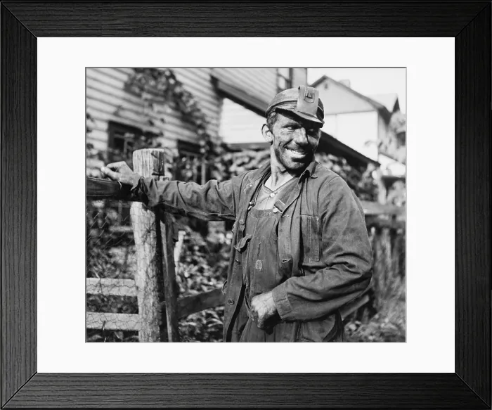 Framed Print : Smiling Polish-American miner, in work clothes and covered with coal dust, arriving home from work in Capels, West Virginia. 1938 photo by Marion Post Wolcott