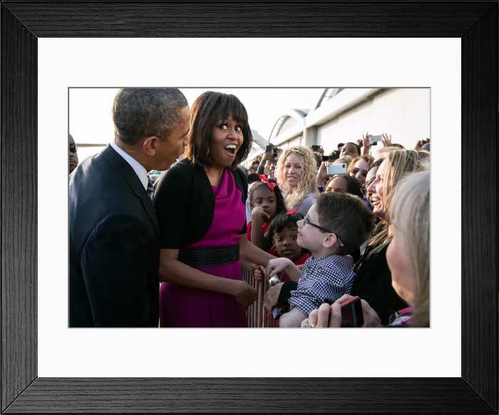 Framed Print : First Lady Michelle Obama reacts while talking with people along a rope line. She and President Barack Obama were at Love Field Airport in Dallas, Texas, April 24, 2013