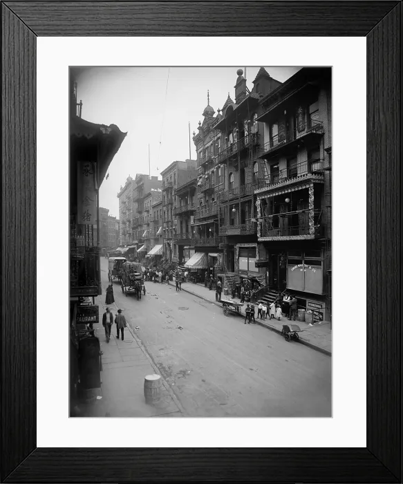 Framed Print : Mott Street in New York City's Chinatown presents a cosmopolitan scene mixing Asian and American-European dress and faces