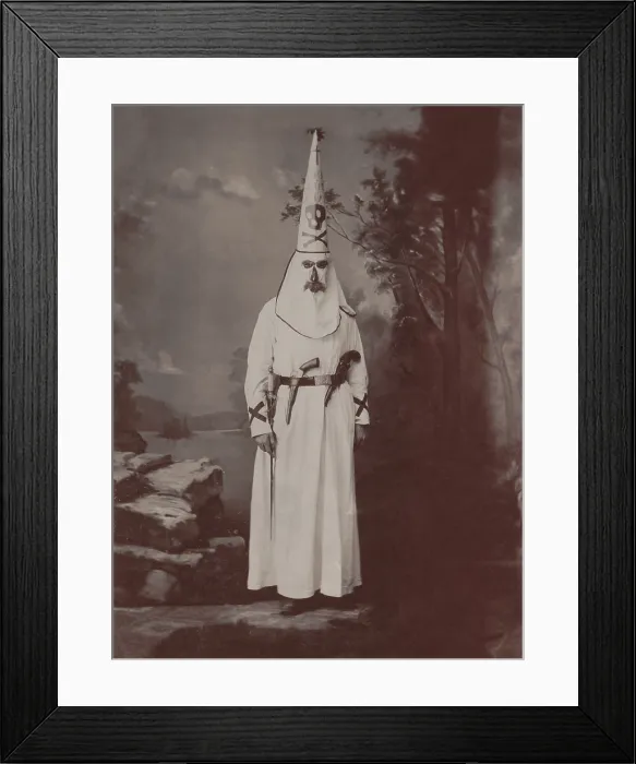 Framed Print : Ku Klux Klansman in robes, armed with two pistols and a sword, c. 1880-1905. Photo by Owen A. Kenefick, of Lawrence, Mass