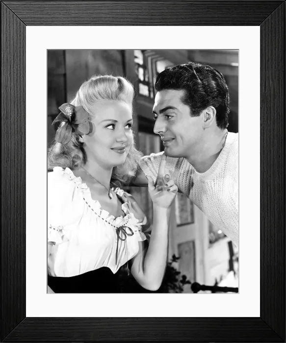 Framed Print : SONG OF THE ISLANDS, from left, Betty Grable, Victor Mature, 1942, 20th Century Fox, TM & Copyright / Courtesy: Everett Collection Framed Print : SONG OF THE ISLANDS, from left, Betty Grable, Victor Mature, 1942, 20th Century Fox, TM & Copyright / Courtesy: Everett Collection
