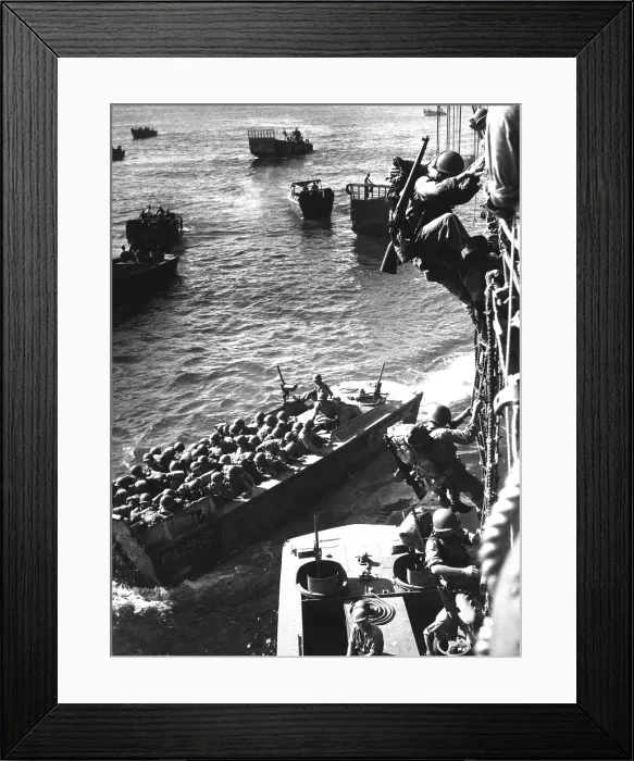 Framed Print : U.S. Marine invasion of Japanese held Bougainville, in the Solomon Islands, Nov. 1, 1943. Soldiers climb down rope nets to Coast Guard landing barges
