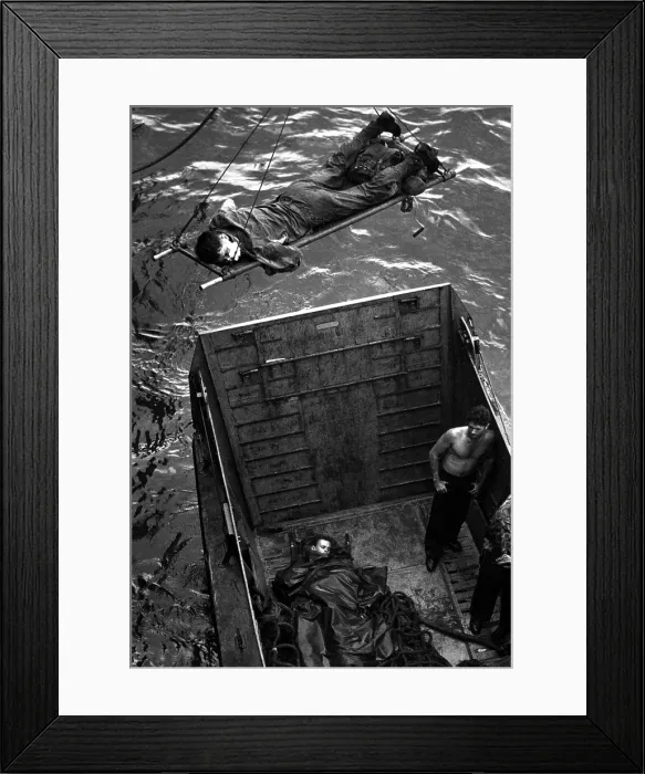 Framed Print : U.S. Marines wounded in the initial invasion at Empress Augusta Bay, Bougainville, against the Japanese. Nov. 1943. The casualty is hoisted aboard a Coast Guard-manned transport Framed Print : U.S. Marines wounded in the initial invasion at Empress Augusta Bay, Bougainville, against the Japanese. Nov. 1943. The casualty is hoisted aboard a Coast Guard-manned transport