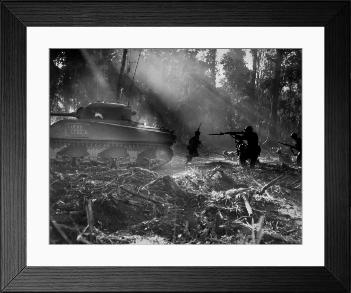 Framed Print : U.S. soldiers advance in the cover of a tank on Bougainville, March 1944. At night Japanese troops would infiltrate American lines. At dawn doughboys would clear them out