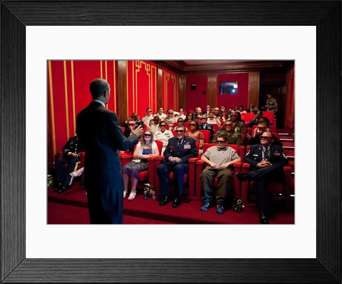 Framed Print : President Obama welcomes service members and their families to the White House Family Theater. They are prepared to watch the 3-D movie, MEN IN BLACK 3, May 25, 2012
