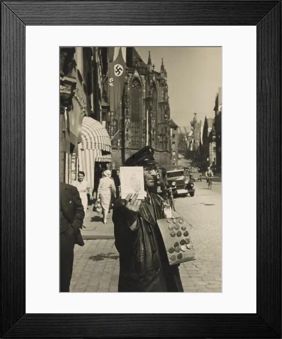 Framed Print : German street vendor sells Nazi political buttons on the street. Ca. 1930. (BSLOC_2014_7_3) Framed Print : German street vendor sells Nazi political buttons on the street. Ca. 1930. (BSLOC_2014_7_3)