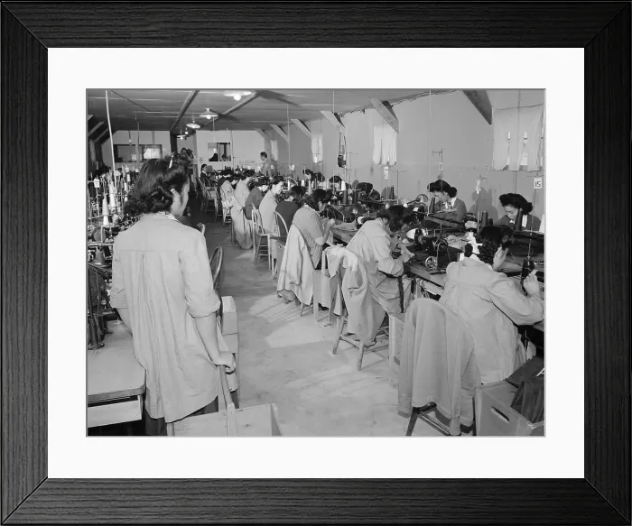 Framed Print : Interned Japanese American, Sumiko Shigematsu, standing at left, supervises fellow internees working at sewing machines at Manzanar Relocation Center, California
