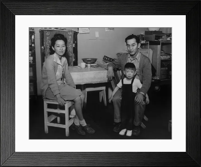 Framed Print : Japanese American family interned at Manzanar Relocation Center during World War II. Mr. and Mrs. Henry J. Tsurutani pose in their barracks with their son, Bruce Framed Print : Japanese American family interned at Manzanar Relocation Center during World War II. Mr. and Mrs. Henry J. Tsurutani pose in their barracks with their son, Bruce