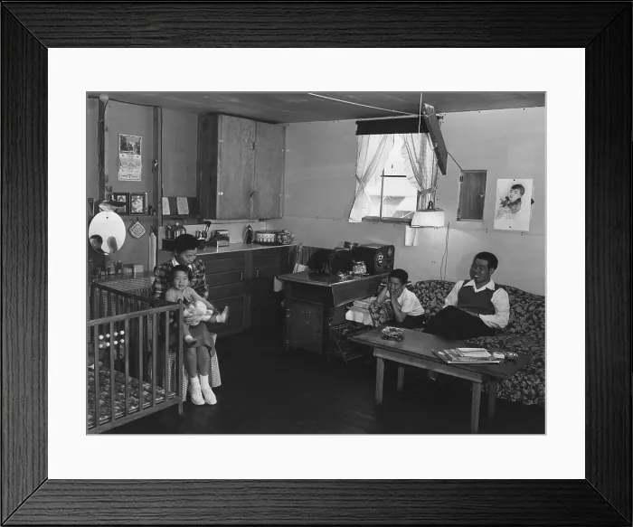 Framed Print : Japanese American family interned at Manzanar Relocation Center during World War II. Mr. & Mrs. Richard Izuno and their two children pose a one-room (approx)
