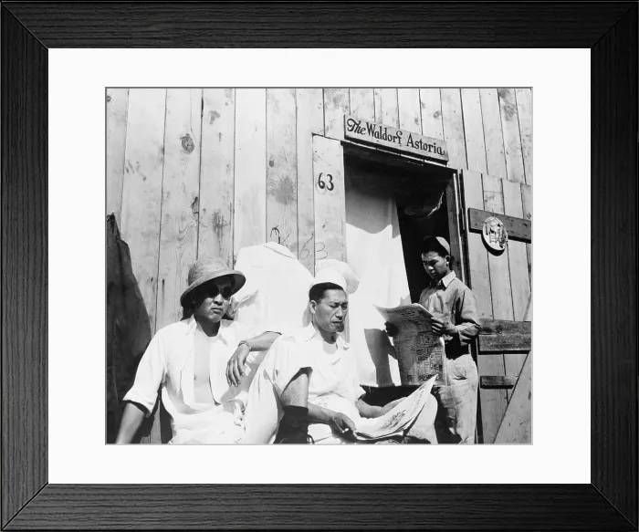 Framed Print : Japanese American men from Seattle, Washington sit outside a barracks during their four month stay at Puyallup Assembly Center in 1942 Framed Print : Japanese American men from Seattle, Washington sit outside a barracks during their four month stay at Puyallup Assembly Center in 1942