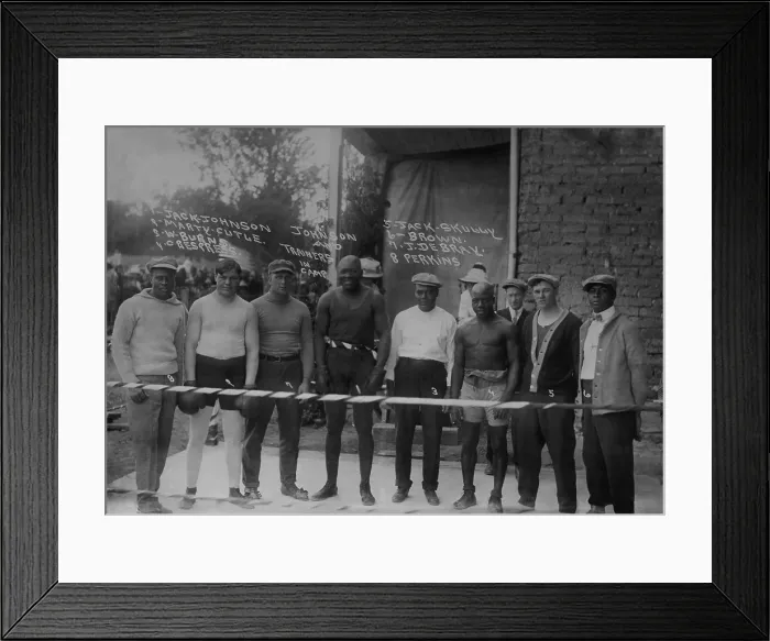 Framed Print : Group portrait of boxer Jack Johnson, Heavy Weight Champion, at his training camp, 1910-15. L-R: Perkins; Marty Cutle; J. Debray; Jack Johnson; W. Burns; C Framed Print : Group portrait of boxer Jack Johnson, Heavy Weight Champion, at his training camp, 1910-15. L-R: Perkins; Marty Cutle; J. Debray; Jack Johnson; W. Burns; C