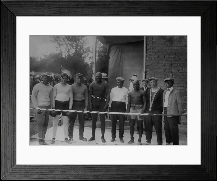 Framed Print : Group portrait of boxer Jack Johnson, Heavy Weight Champion, at his training camp, 1910-15. L-R: Perkins; Marty Cutle; J. Debray; Jack Johnson; W. Burns; C