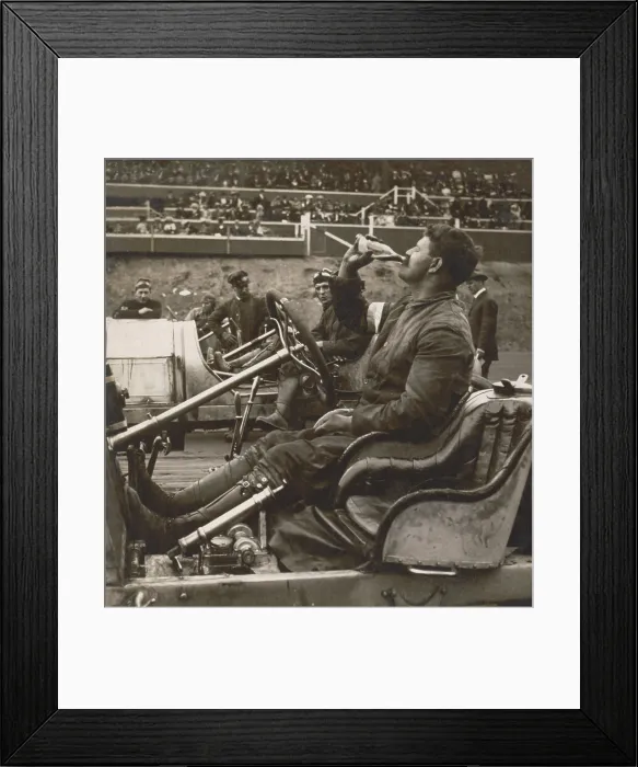 Framed Print : Auto racer, Louis Chevrolet in his open-cockpit automobile drinking Coca-Cola