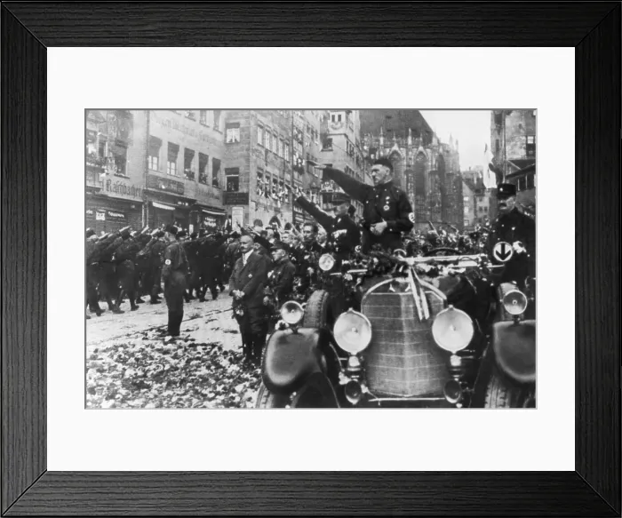 Framed Print : Adolf Hitler reviews marching Nazi Storm Troopers the 3rd Party Congress. Sub-titled Day of Awakening, it was held in Nuremberg on Aug. 20, 1927. (BSLOC_2015_13_42) Framed Print : Adolf Hitler reviews marching Nazi Storm Troopers the 3rd Party Congress. Sub-titled Day of Awakening, it was held in Nuremberg on Aug. 20, 1927. (BSLOC_2015_13_42)