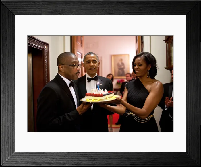 Framed Print : President Barack Obama and Michelle Obama present a birthday cake to Assistant Usher Reggie Dickson. June 13, 2012. (BSLOC_2015_13_209)
