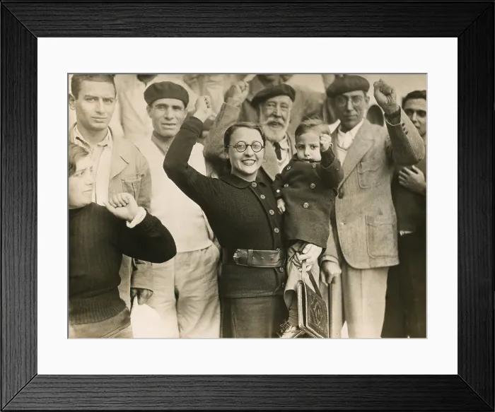 Framed Print : Defeated Spanish Republican refugees give their clenched fist salute in Bordeaux, France. Spanish Civil War. 1939. (BSLOC_2014_7_49)