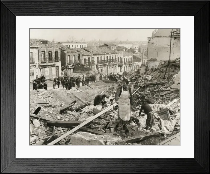 Framed Print : Civilians in Madrid search through the rubble of their homes in Liberated Madrid'. The Nationalists finally captured the besieged city on March 28, 1939 Framed Print : Civilians in Madrid search through the rubble of their homes in Liberated Madrid'. The Nationalists finally captured the besieged city on March 28, 1939