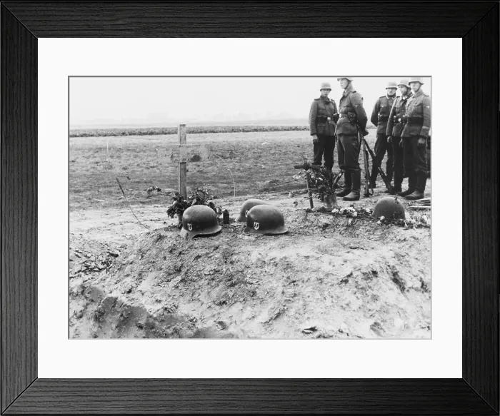 Framed Print : German Waffen-SS troops at the helmet topped graves of their fellows during the invasion of Poland. Sept. 1939. World War 2. (BSLOC_2014_7_61) Framed Print : German Waffen-SS troops at the helmet topped graves of their fellows during the invasion of Poland. Sept. 1939. World War 2. (BSLOC_2014_7_61)