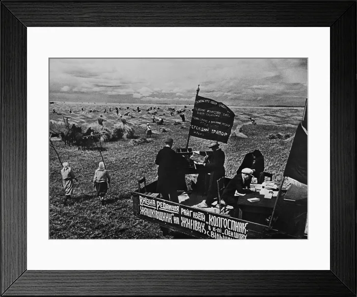 Framed Print : Setting the district newspaper, Collective Farmer in the fields of a Soviet farm. Ca. 1935-40. Near Kiev, Ukraine, USSR. (BSLOC_2015_2_253)