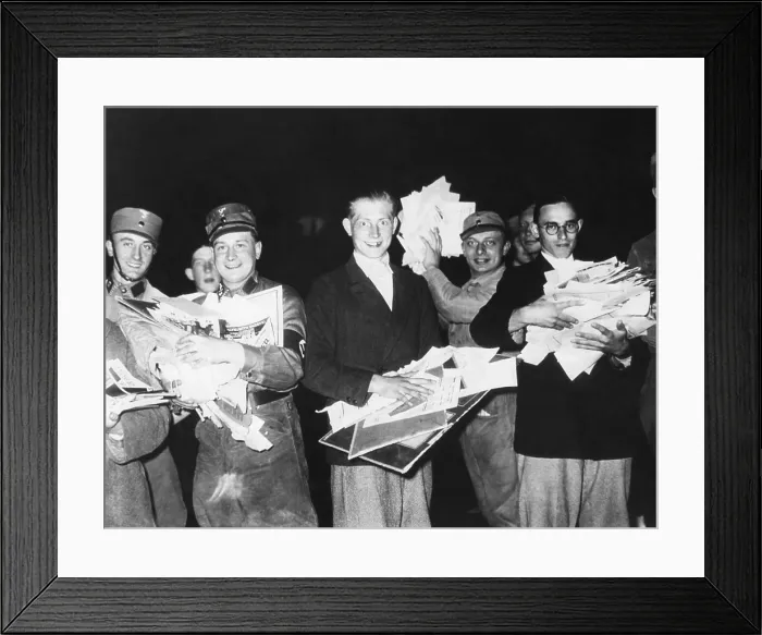 Framed Print : Nazi Storm troopers and young German men holding pictures and pamphlets at public book burning. Ca. 1933-1940. (BSLOC_2015_13_53) Framed Print : Nazi Storm troopers and young German men holding pictures and pamphlets at public book burning. Ca. 1933-1940. (BSLOC_2015_13_53)