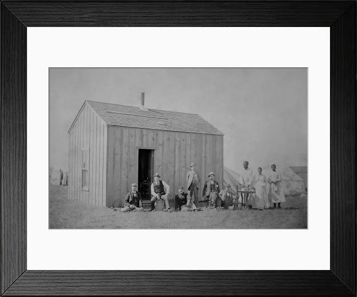 Framed Print : W. H. McCoys claim, at Perry, Oklahoma, Territory, Oct. 1, 1893. A group of six men, including a soldier, pose in front of a lumber cabin, with tents in the background