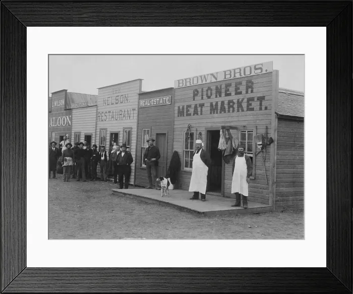 Framed Print : Shopkeepers and customers pose in doorways of new businesses on Broadway Street, Round Pond, Oklahoma Territory