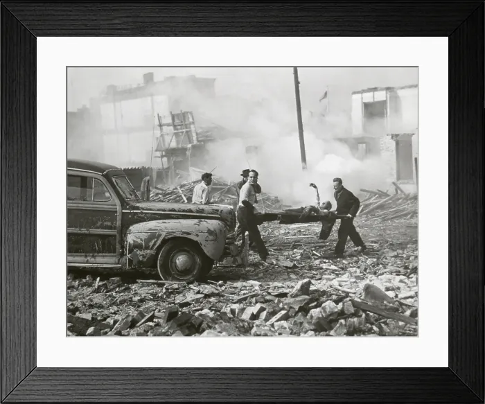 Framed Print : Movie still from a U.S. Army film about a hypothetical attack using an atomic bomb, Nov. 1948. Still shows rescue workers are shown removing the injured from shattered homes