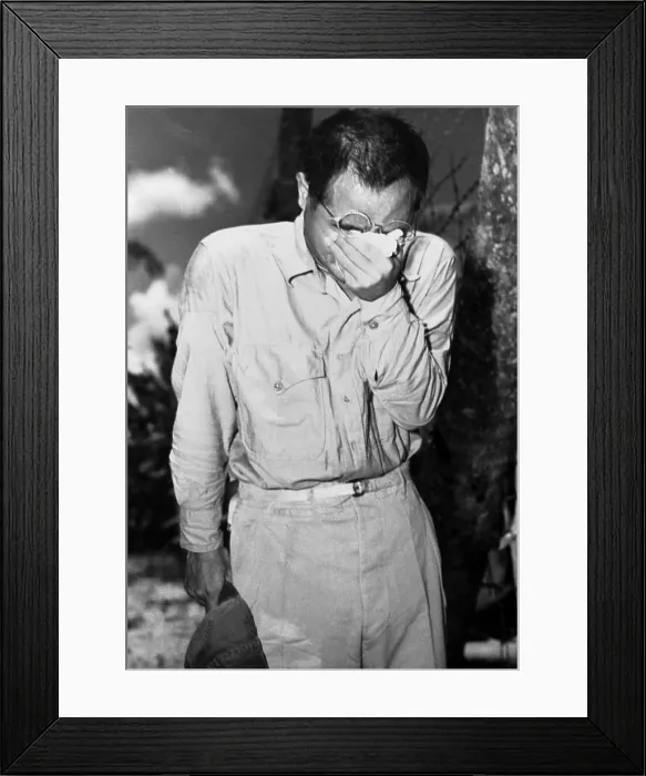 Framed Print : Japanese POW on Guam after hearing Emperor Hirohito announce of Japan's surrender. August 15, 1945, at the end of World War 2. (BSLOC_2013_14_279) Framed Print : Japanese POW on Guam after hearing Emperor Hirohito announce of Japan's surrender. August 15, 1945, at the end of World War 2. (BSLOC_2013_14_279)