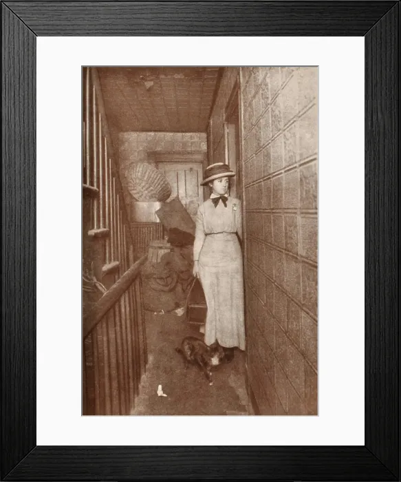 Framed Print : A Public Health visiting nurse from Henry Street Settlement House visits a tenement, c. 1900. On New Yorks Lower East Side, 90% of the sick remained at home without medical care