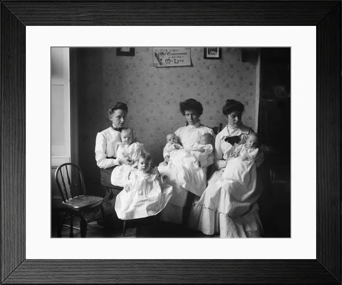 Framed Print : Three young women hold five babies at the Childrens Aid Society