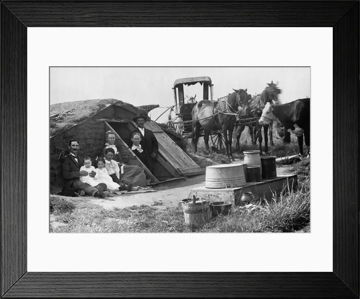 Framed Print : Two families posing in front of an Oklahoma dugout home share the novelty of having their picture taken
