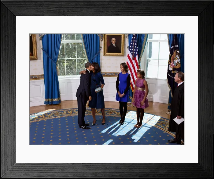 Framed Print : President Barack Obama and Michelle Obama embrace after the official swearing-in ceremony. The ceremony was held on Sunday, Jan
