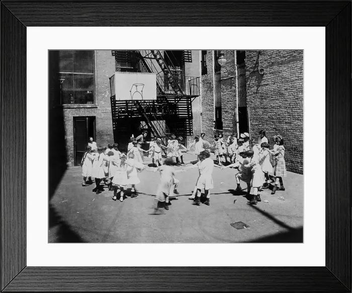 Framed Print : Children play ring-around-a-rosy in a settlement house yard, 1918