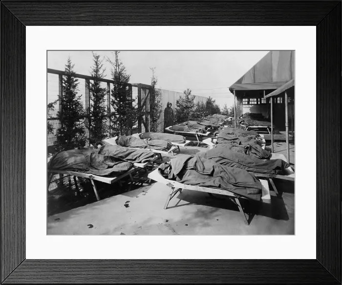 Framed Print : Children lie on cots, wrapped in blankets, on the roof of Hull House Boys Club, c. 1910. The children were in their rest period at Elizabeth McCormick Open Air School No. 2