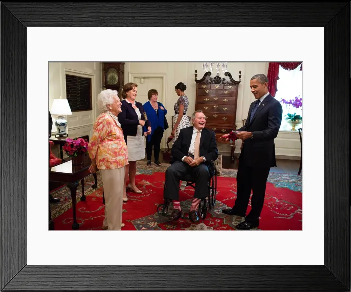 Framed Print : George H. W. and Barbara Bush present President Barack Obama with a pair of colorful socks. July 15, 2013 Framed Print : George H. W. and Barbara Bush present President Barack Obama with a pair of colorful socks. July 15, 2013