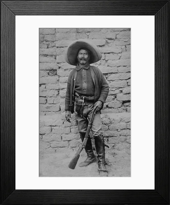 Framed Print : Peon rebel volunteer in the Mexican Revolution, c. 1910-1919. He is armed with a rifle, revolver and knife Framed Print : Peon rebel volunteer in the Mexican Revolution, c. 1910-1919. He is armed with a rifle, revolver and knife
