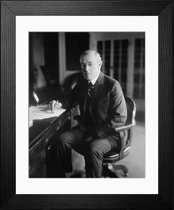Framed Print : President Woodrow Wilson, seated at his desk in the Oval Office, White House, c. 1913-1916 (BSLOC_2016_11_11)