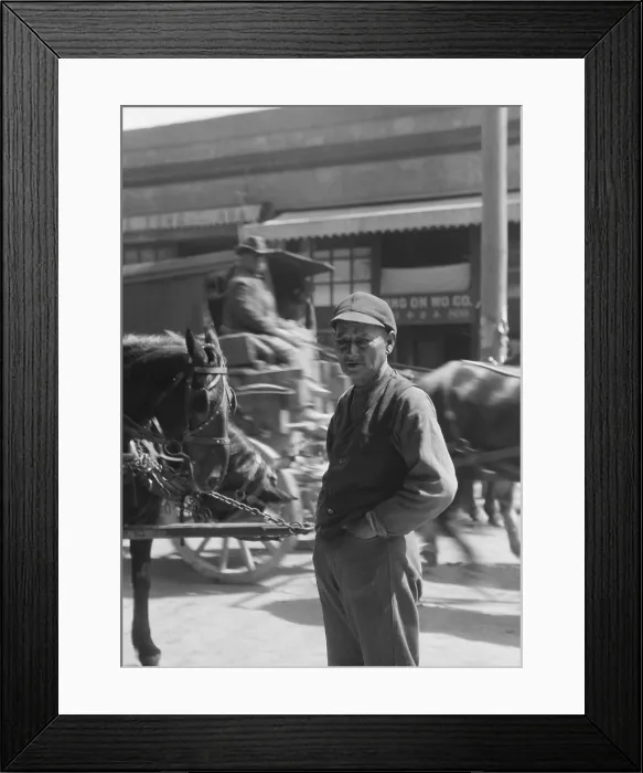 Framed Print : Portrait of middle aged Chinese-American man standing near wagon traffic. Photo by Arnold Genthe, c. 1896-1911, possibly taken in Chinatown, San Francisco (BSLOC_2018_1_48) Framed Print : Portrait of middle aged Chinese-American man standing near wagon traffic. Photo by Arnold Genthe, c. 1896-1911, possibly taken in Chinatown, San Francisco (BSLOC_2018_1_48)