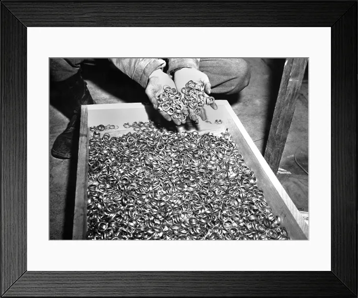 Framed Print : Thousands of gold wedding rings removed from victims of the Nazi German concentration camps. U.S