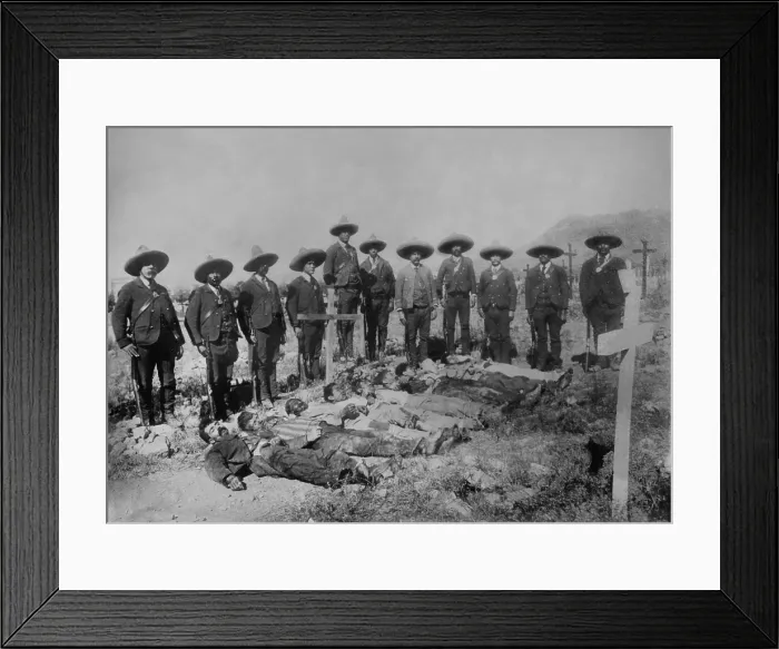 Framed Print : Mexican Rurales, the Federal mounted police, stand over the bodies in a cemetery